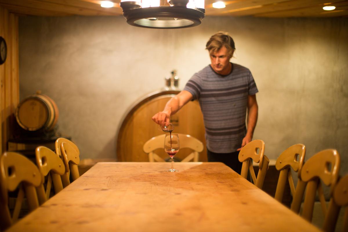 Pouring a glass at Jamesport Vineyards. (Bridget Elkin Photography)