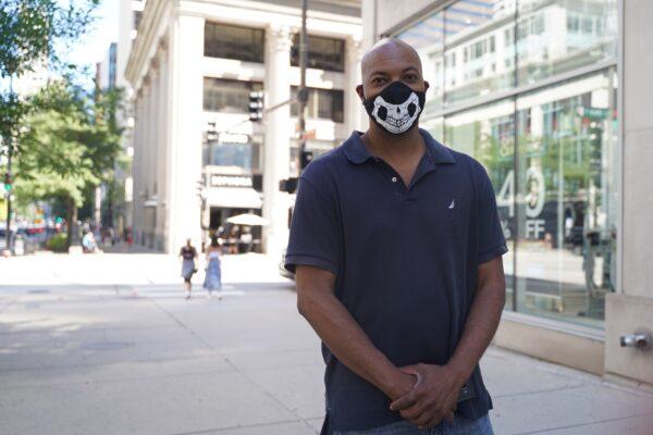 Michael Lawry, a local resident, stands in downtown Chicago, on Aug. 11, 2020. (Cara Ding/The Epoch Times)