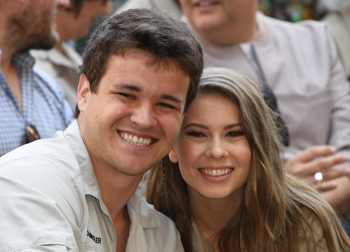 Wakeboarder Chandler Powell (L) and conservationist and TV personality Bindi Irwin (R) pose for a photo at the ceremony for Steve Irwin, who was honored posthumously with a Star on the Hollywood Walk of Fame in Hollywood, California, on April 26, 2018. (MARK RALSTON/AFP via Getty Images)