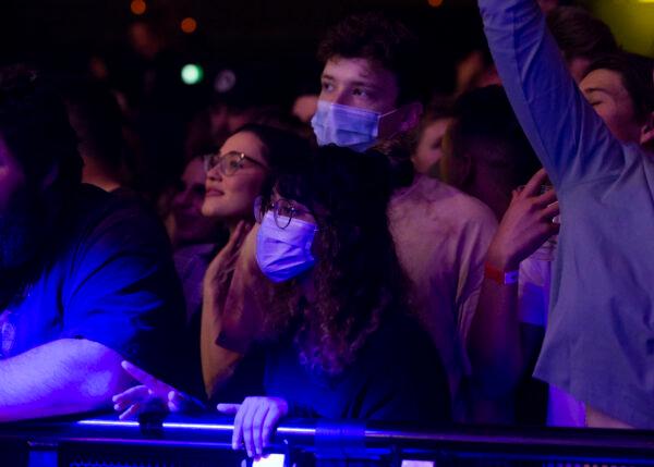 Music fans wear PPE at Castaway Unlocked at HBF Stadium in Perth, Australia on July 18, 2020. The WA Unlocked event is the first live music concert to be held in Western Australia since COVID-19 restrictions were imposed. (Matt Jelonek/Getty Images)