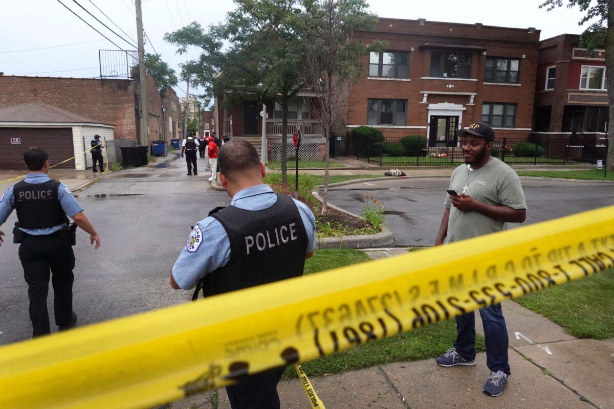 Police secure the scene of a shooting in the Auburn Gresham neighborhood in Chicago, on July 21, 2020. (Scott Olson/Getty Images)