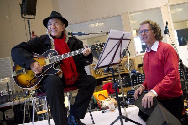 Dutch violinist and conductor Andre Rieu (R) practices with U.S. singer Trini Lopez (L) in his studio in Maastricht, as part of the preparation of a new musical project, Netherlands, on Feb. 22, 2013. (Marcel Van Hoorn/AFP via Getty Images)