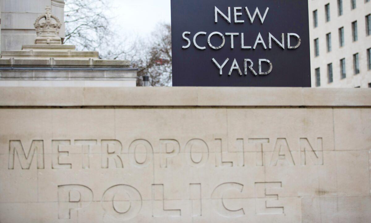 The New Scotland Yard logo is displayed on a revolving sign outside the Curtis Green Building, the new home of the Metropolitan Police in London on Feb. 22, 2017. (Jack Taylor/Getty Images)