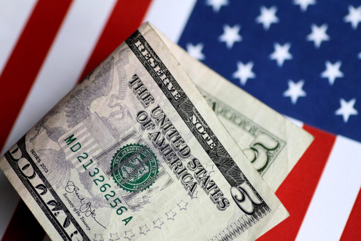 A U.S. $5 note on June 1, 2017. (Thomas White/Illustration via Reuters)