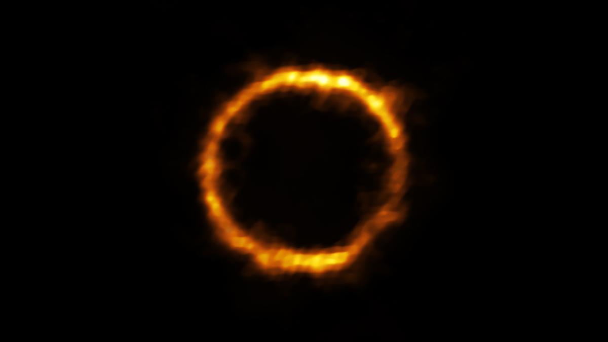 Astronomers using ALMA, in which the ESO is a partner, have revealed an extremely distant galaxy that looks surprisingly like our Milky Way. The galaxy, SPT0418-47, is gravitationally lensed by a nearby galaxy, appearing in the sky as a near-perfect ring of light. (Courtesy of Rizzo et al./ALMA/European Southern Observatory)