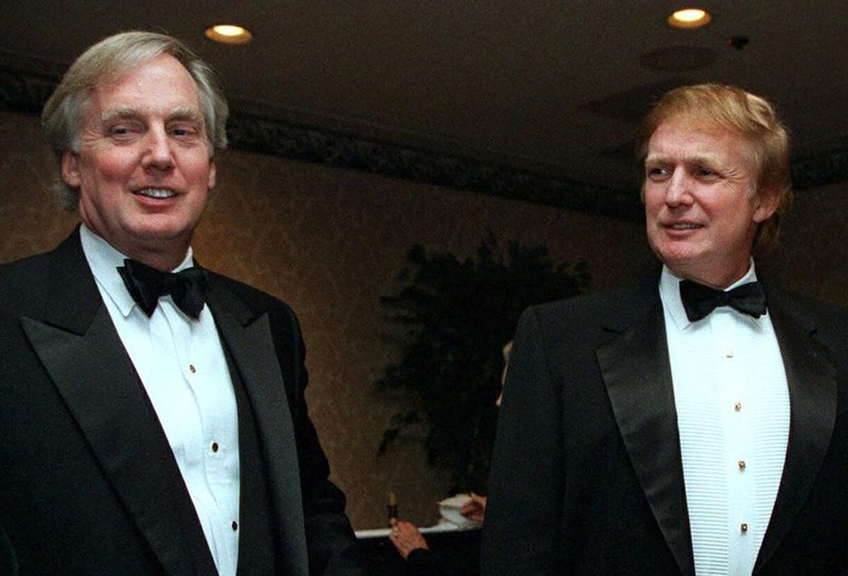 Robert Trump (L) joins real estate developer and presidential hopeful Donald Trump at an event in New York, N.Y., on Nov. 3, 1999. (Diane Bonadreff/AP Photo)