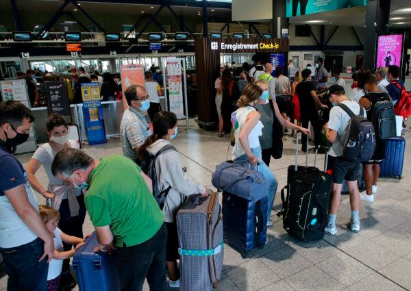 People line up to check in at the Biarritz airport in France, on Aug. 14, 2020. (Bob Edme/AP Photo)
