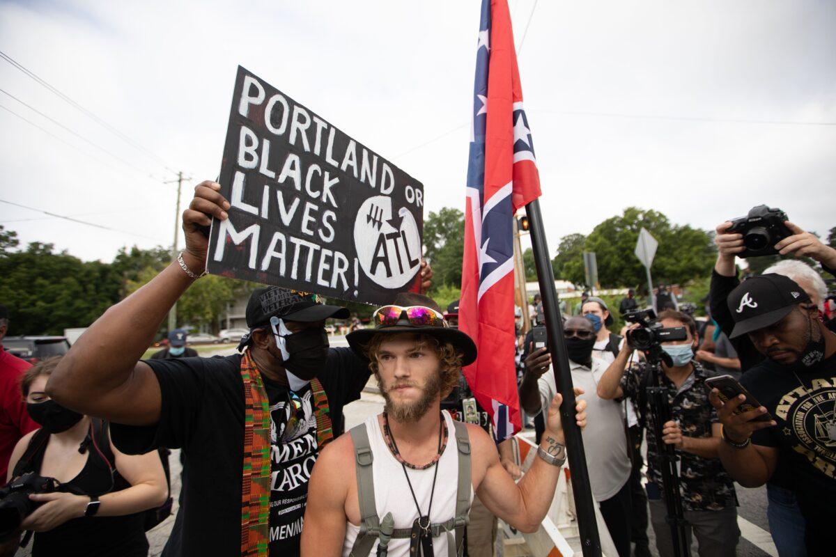 A Black Lives Matter activist shouts at a rallier during an event held in support of Confederate monuments in Stone Mountain, Ga., on Aug. 15, 2020. (Logan Cyrus/AFP via Getty Images)