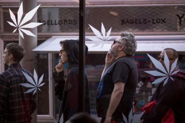People stand in line outside of a store that sells marijuana for recreational use in West Hollywood, Calif., on Jan. 2, 2018. (David McNew/Getty Images)