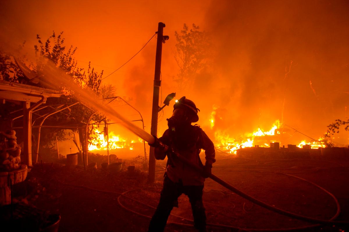 A firefighter works against the Lake Hughes Fire in Angeles National Forest north of Santa Clarita, Calif., on Aug. 12, 2020. (Ringo H.W. Chiu/AP Photo)