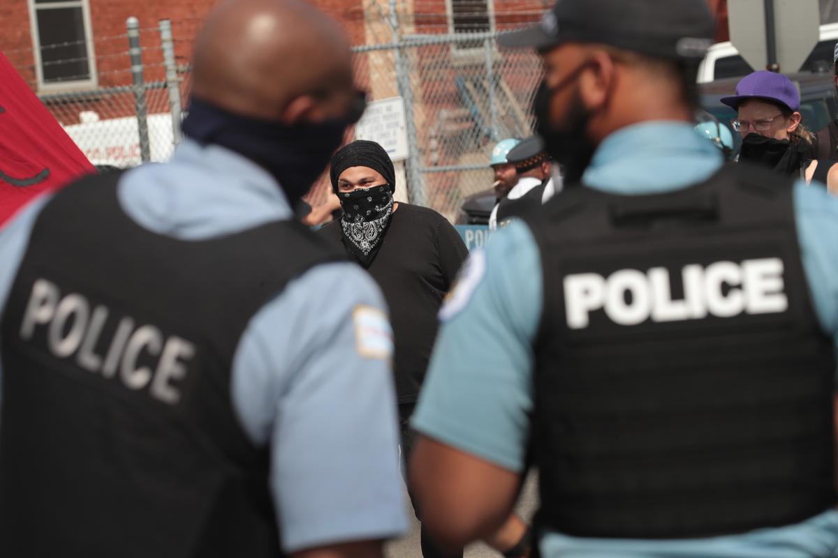Police officers and demonstrators are seen during a protest in Chicago, Ill., on Aug. 15, 2020. (Scott Olson/Getty Images)