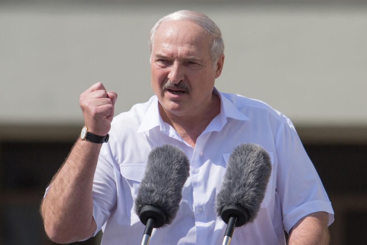 Belarusian President Alexander Lukashenko gestures as he delivers a speech during a rally of his supporters near the Government House in Independence Square in Minsk, Belarus, on Aug. 16, 2020. (Stringer/Reuters)