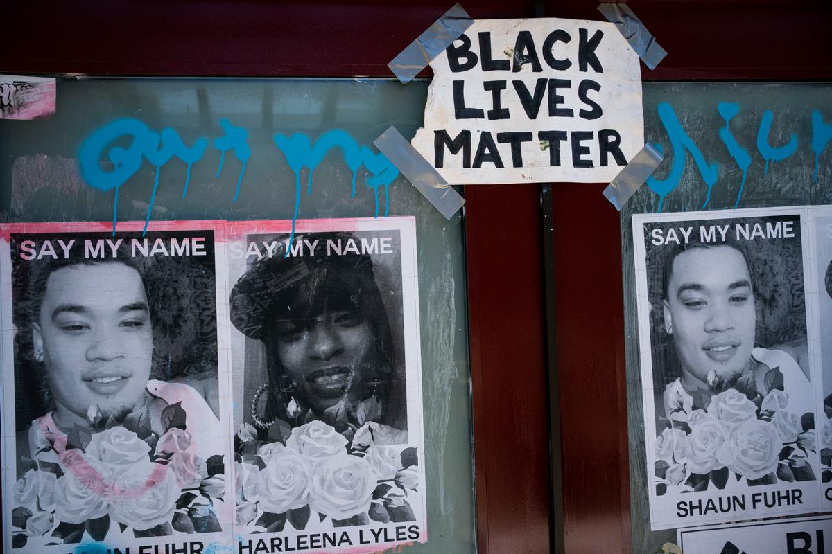 Images of local victims of police violence are seen on a Seattle Parks and Recreation structure, which was used by protesters operating a mutual aid station, after police conducted a sweep of Cal Anderson Park in the area formerly known as CHOP in Seattle, Wash., on Aug. 14, 2020. (David Ryder/Getty Images)