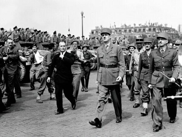General Charles de Gaulle (C) and other generals walk toward the Champs <span class="st">Élysées</span> for a march before a ceremony at Notre Dame Cathedral following the Liberation of Paris, on Aug. 26, 1944. (-/AFP via Getty Images)