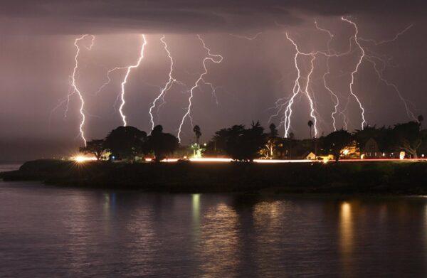 A rare lightning storm crackles over Mitchell's Cove in Santa Cruz, California around 3 a.m., on Aug. 16, 2020. (Shmuel Thaler/The Santa Cruz Sentinel via AP)