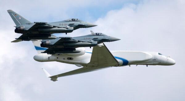 Two German air force Bundeswehr Eurofighters and an Israeli Air Force jet fly in formation over the Fuerstenfeldbruck airbase in commemoration of the 1972 Olympic Games assassination attempt in Fuerstenfeldbruck, Germany, Tuesday, Aug. 18, 2020. (Sven Hoppe/dpa via AP Photo)