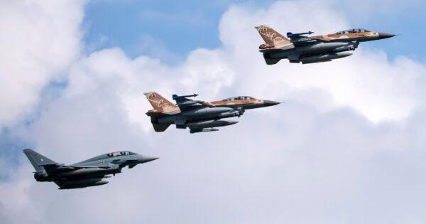A German air force Bundeswehr Eurofighter and two Israeli Air Force F-16 jets fly in formation over the Fuerstenfeldbruck airbase in commemoration of the 1972 Olympic Games assassination attempt in Fuerstenfeldbruck, Germany, on Aug. 18, 2020. (Sven Hoppe/dpa via AP Photo)