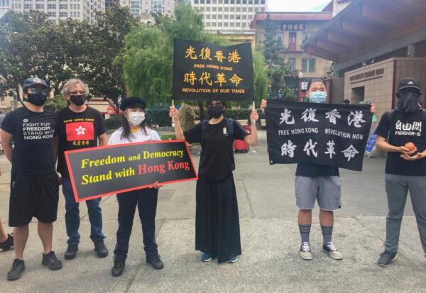  Hong Kong supporters show support for removing the PRC flag in San Francisco. (Ilene Eng/The Epoch Times)