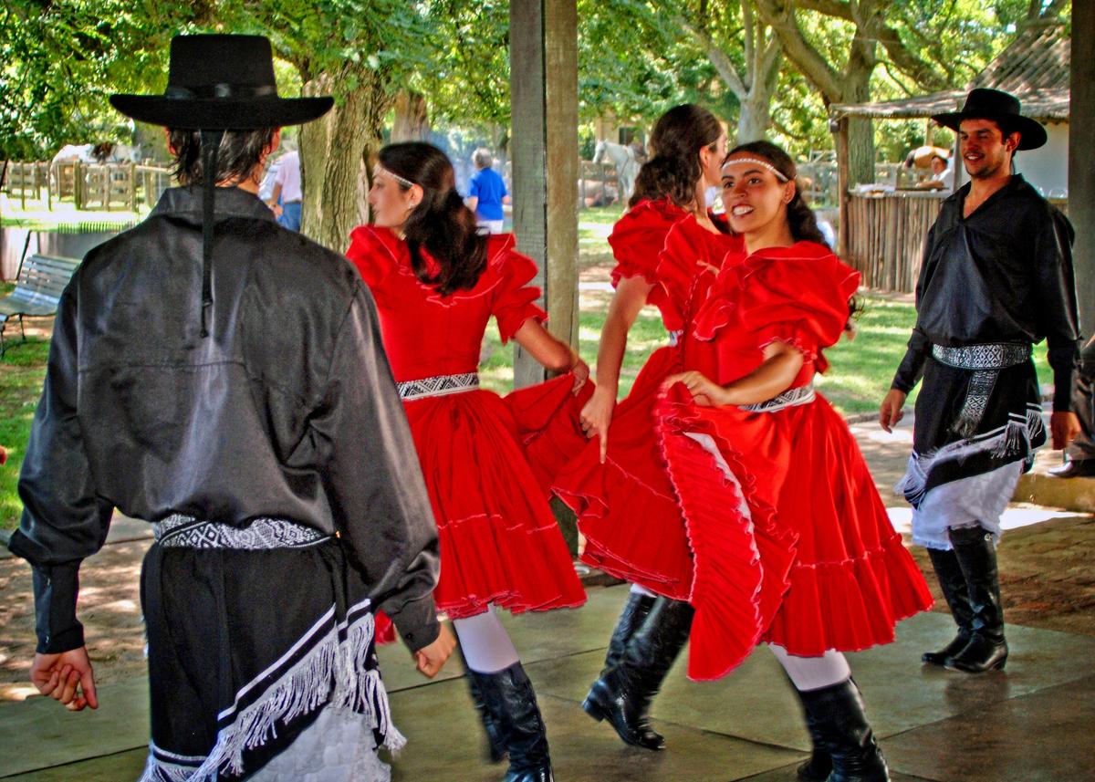 Tourists who visit a ranch such as Estancia La Rabida enjoy performances of traditional gaucho dances and songs. (Copyright Fred J. Eckert)