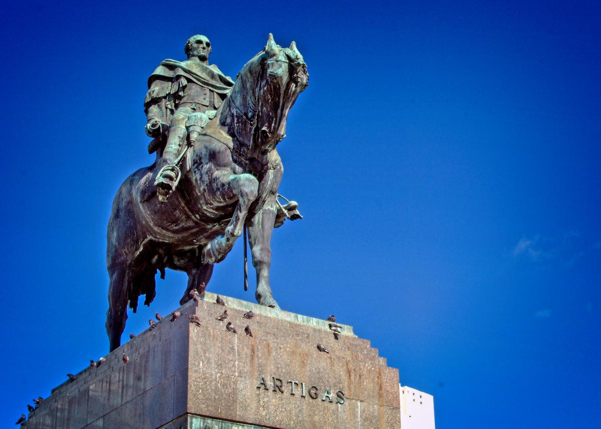 Montevideo’s Independence Square is marked by the statue of Uruguay’s national hero, Jose Gervasio Artigas, whose remains lie in a mausoleum built under the monument. (Copyright Fred J. Eckert)