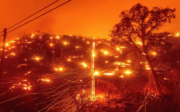 Embers burn along a hillside as the LNU Lightning Complex fires tear through unincorporated Napa County, Calif., on Aug. 18, 2020. (Noah Berger/AP Photo)