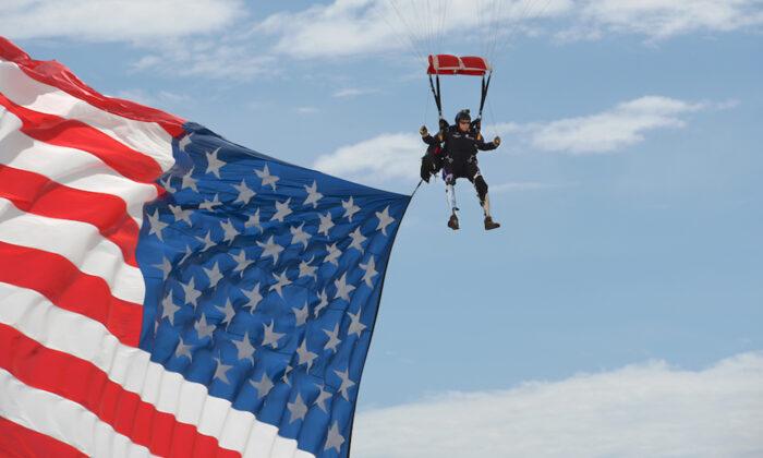 Double Amputee Ex-Green Barret Parachutes In With Giant US Flag at Veterans’ Rally
