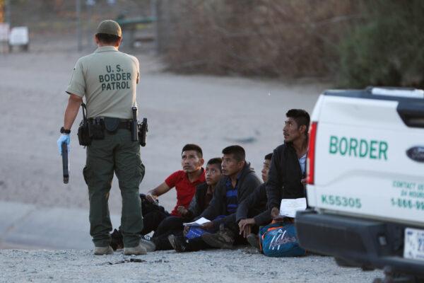A group of illegal aliens is apprehended by Border Patrol after crossing from Mexico into Yuma, Ariz., on April 12, 2019. (Charlotte Cuthbertson/The Epoch Times)