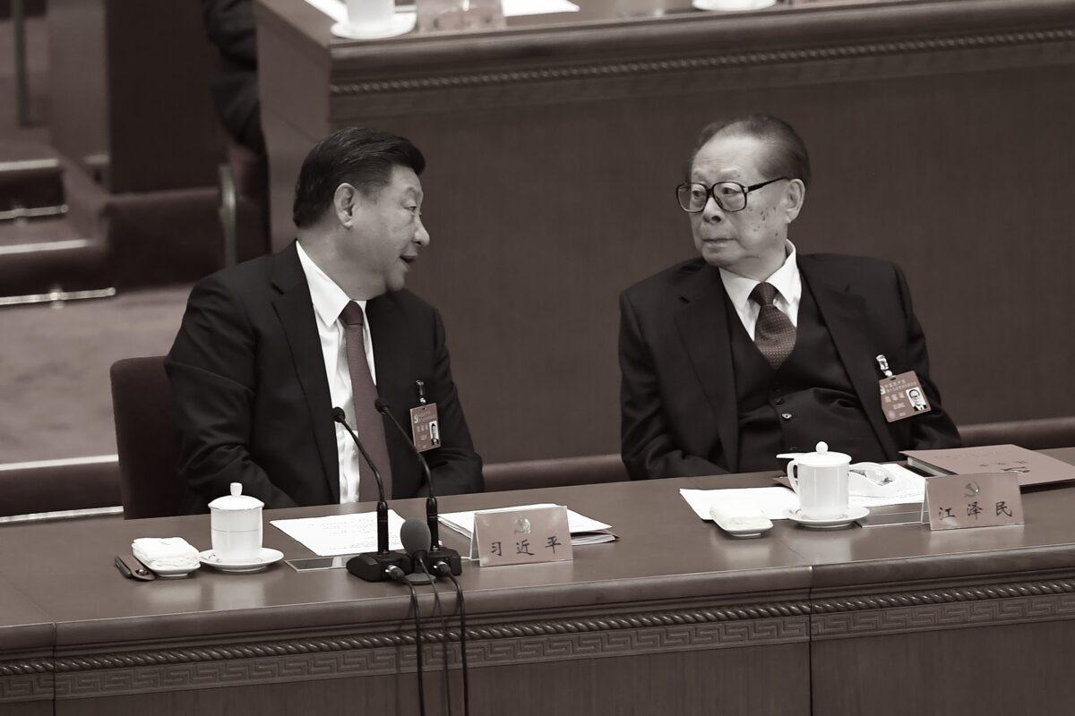 Chinese leader Xi Jinping (L) talks to former leader Jiang Zemin (R) during the closing of the 19th Communist Party Congress at the Great Hall of the People in Beijing, China on Oct. 24, 2017. (Wang Zhao/AFP via Getty Images)