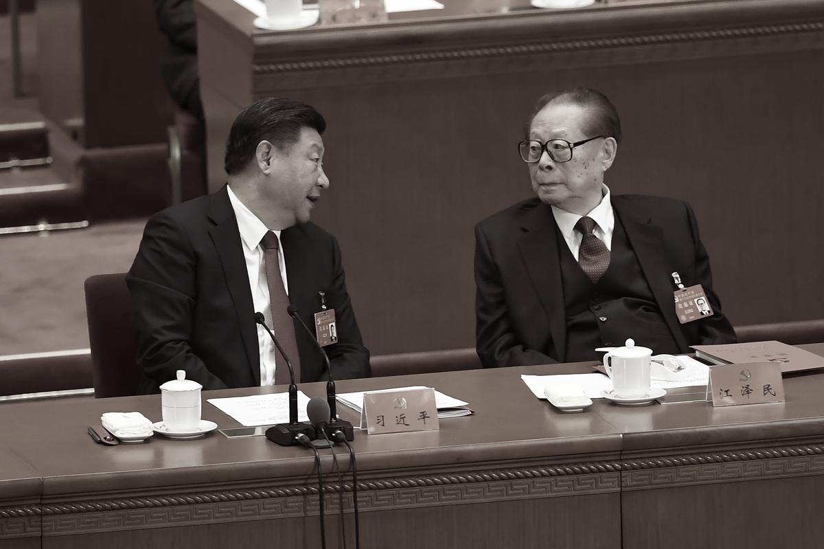 Chinese leader Xi Jinping (left) talks to former leader Jiang Zemin during the closing of the 19th Communist Party Congress at the Great Hall of the People in Beijing, China on Oct. 24, 2017. (Wang Zhao/AFP via Getty Images)