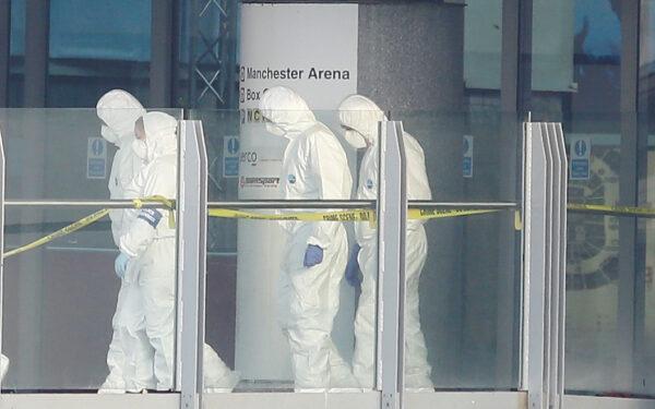 File photo shows forensics investigators working at the entrance of the Manchester Arena, in Manchester, Britain, on May 23, 2017. (Reuters/Andrew Yates)