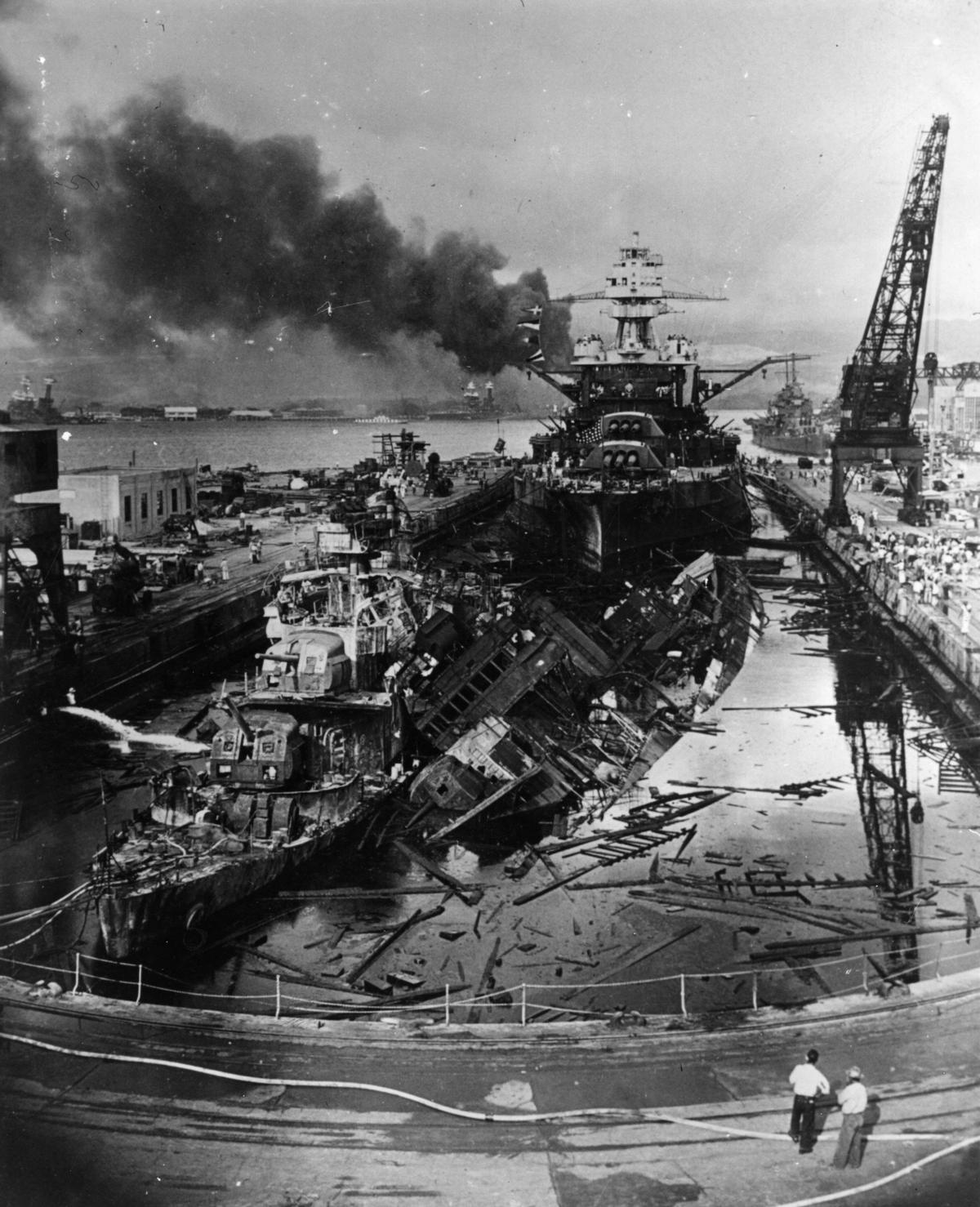The remains of the destroyers USS Downes and USS Cassin in front of the battleship USS Pennsylvania at Pearl Harbor, pictured in December 1941 (Fox Photos/Getty Images)