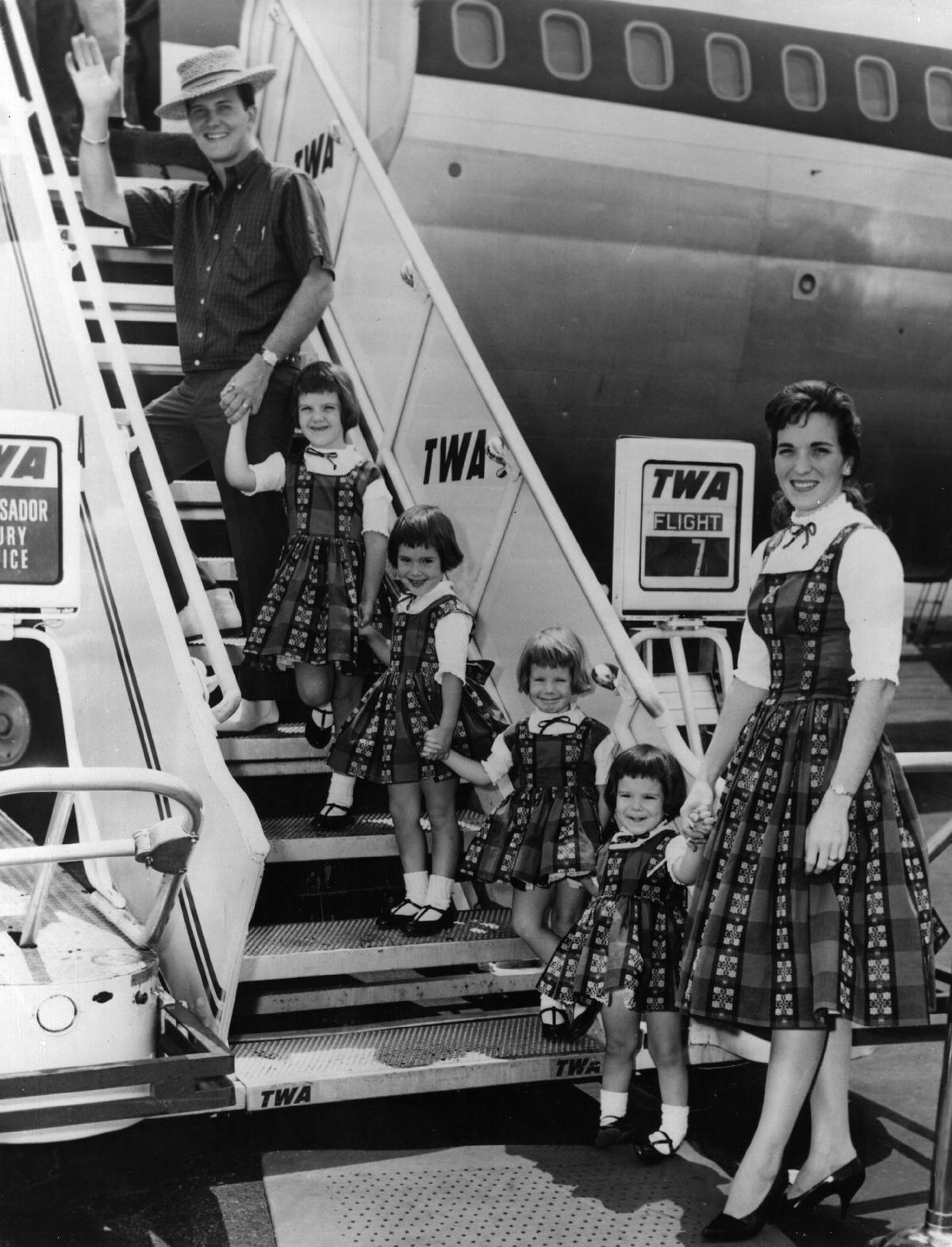 Popular American singer Pat Boone with his wife, Shirley, and their four daughters boarding an aeroplane at New York, bound for their permanent home of Los Angeles. (Keystone/Getty Images)