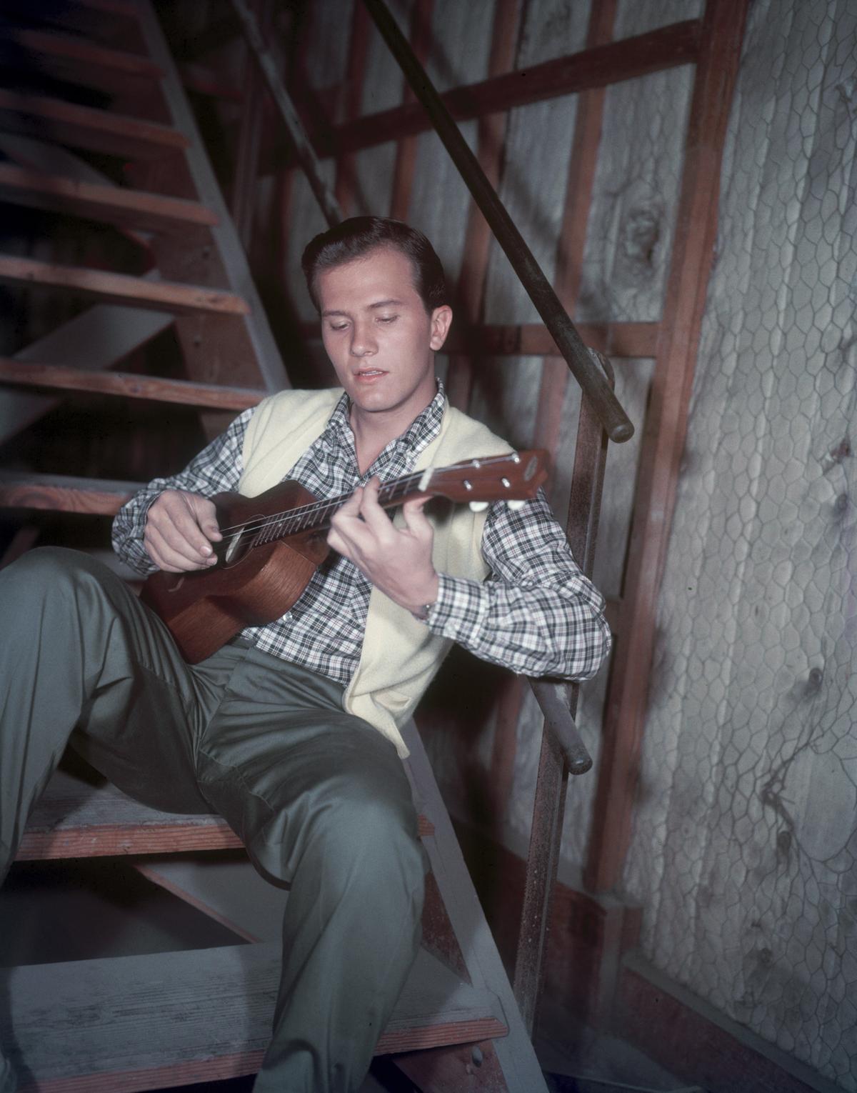 American singer and actor Pat Boone playing the ukulele, circa 1955. (Hulton Archive/Getty Images)