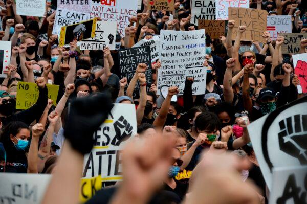 Protesters rally on the steps of the State House during a Black Lives Matter rally in Providence, R.I., on June 5, 2020. (Joseph Prezioso/AFP via Getty Images)