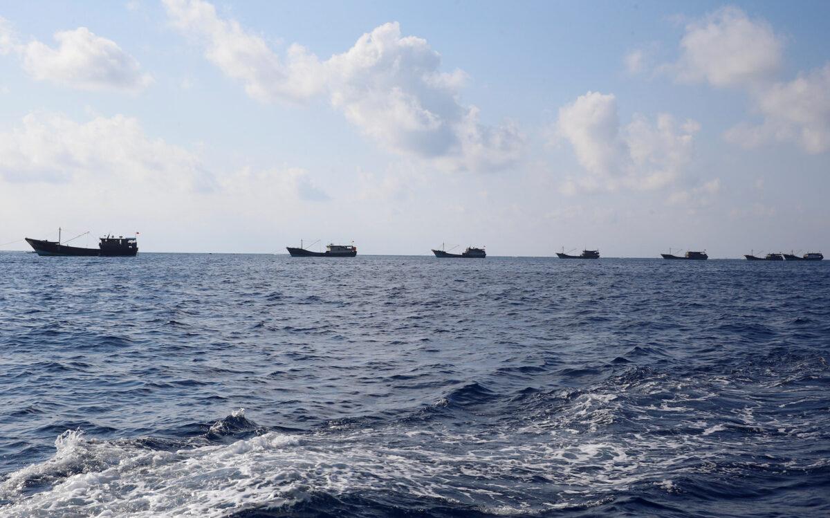 Chinese boats fish at the disputed Scarborough Shoal on April 5, 2017. (Erik De Castro/Reuters)
