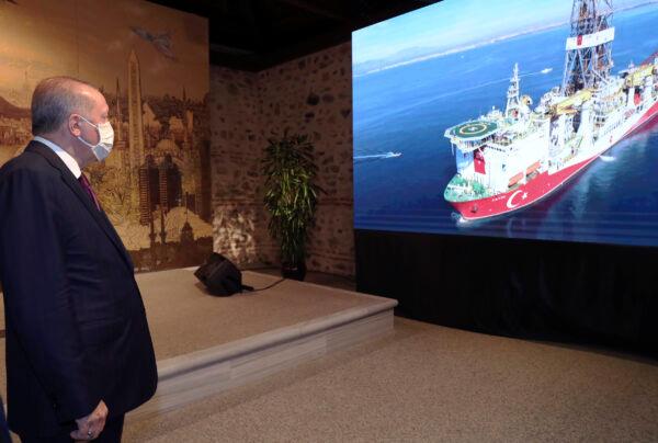 Turkey's President Recep Tayyip Erdogan watches Turkish drilling ship, Fatih, in the background, as he speaks in Istanbul, Turkey, on Aug. 21, 2020. (Turkish Presidency via AP/ Pool)