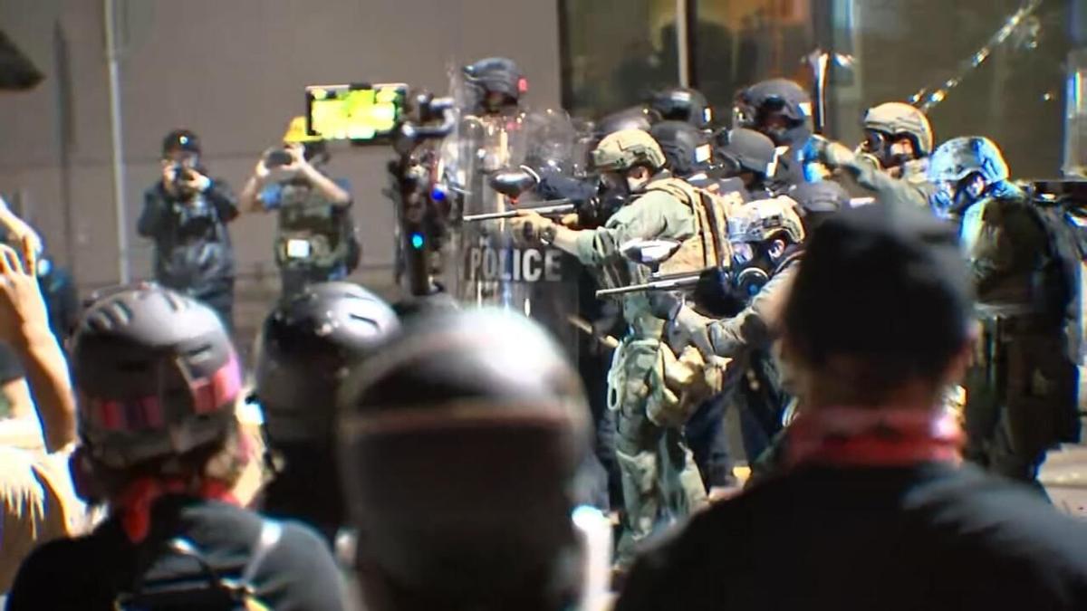 Law enforcement officers respond to rioting outside the Immigration and Customs Enforcement building in South Portland, Ore., on Aug. 20, 2020. (KPTV)