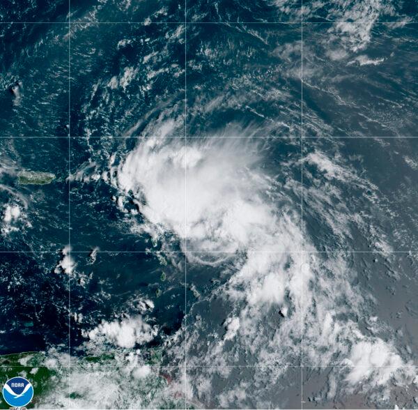 This satellite image released by the National Oceanic and Atmospheric Administration (NOAA) shows Tropical Storm Laura in the North Atlantic Ocean, Friday, Aug. 21, 2020. (NOAA via AP)