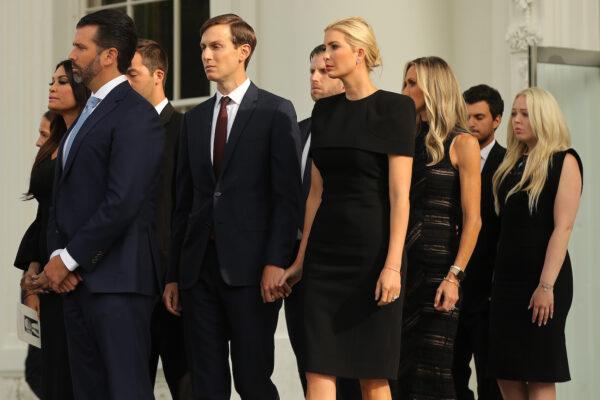 President Donald Trump's children and their partners, (L-R) Kimberly Guilfoyle, Donald Trump Jr., Jared Kushner, Eric Trump, Ivanka Trump, Lara Trump, Michael Boulos, and Tiffany Trump walk onto the White House North Portico following the funeral of Robert Trump in Washington on Aug. 21, 2020. (Chip Somodevilla/Getty Images)