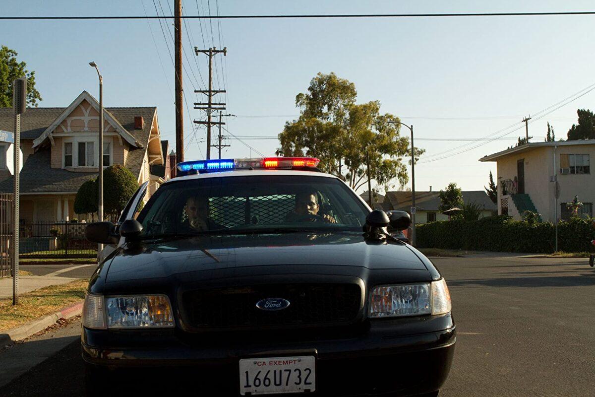 Jake Gyllenhaal (L) and Michael Peña as police partners in their squad car in "End of Watch." (Scott Garfield/Open Road Films)