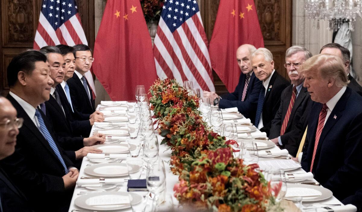 President Donald Trump (R) and China's President Xi Jinping (L) along with members of their delegations, hold a dinner meeting at the end of the G20 Leaders' Summit in Buenos Aires, Argentina, on Dec. 1, 2018. (Saul Loeb/AFP via Getty Images)