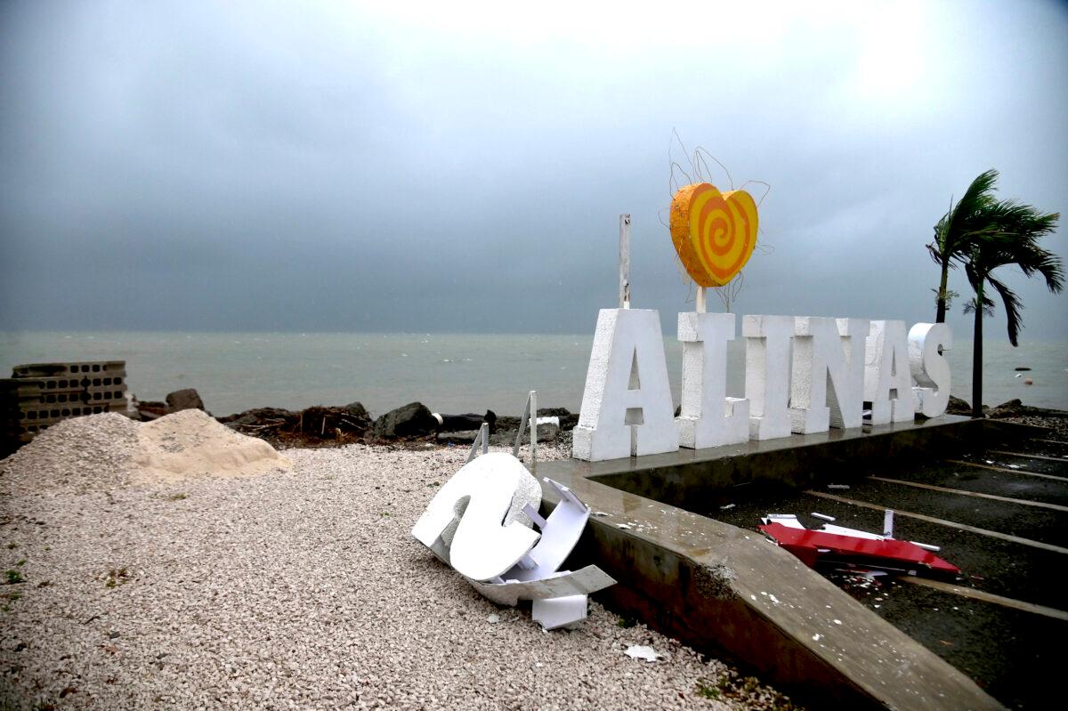 Remnants of city sign lay on the beach, damaged by Tropical Storm Laura in Salinas, Puerto Rico, on Aug. 22, 2020. (Carlos Giusti/AP Photo)