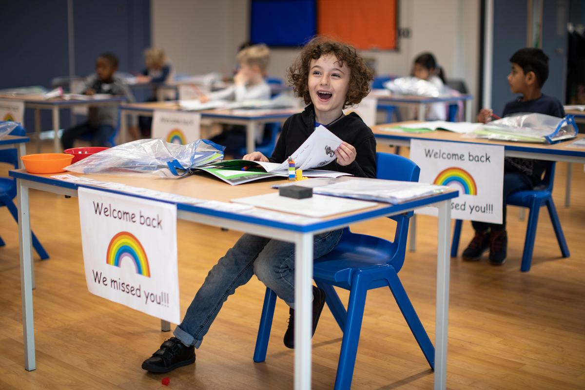 Children sit at individual desks during a lesson at the Harris Academy's Shortland's school in London, UK, on June 4, 2020. (Dan Kitwood/Getty Images)