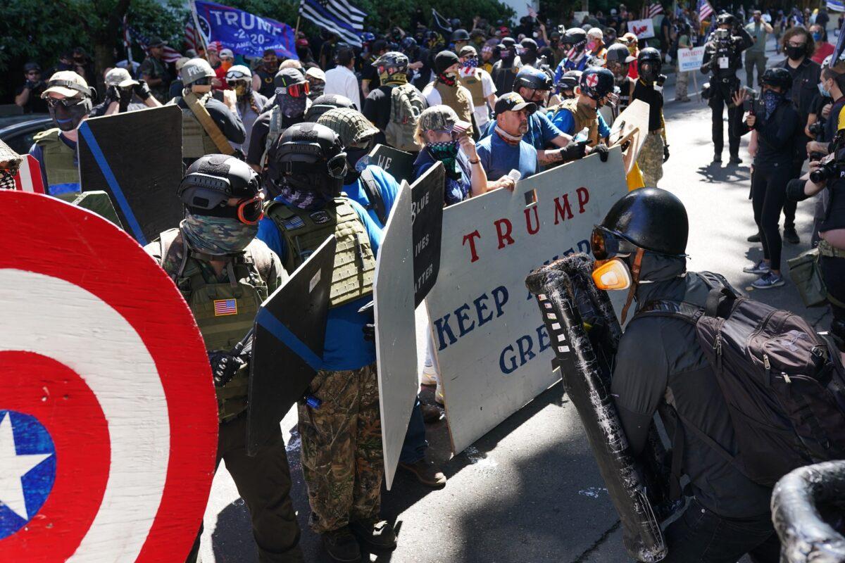 Pro-police demonstrators and others, left, and counter-protesters clash in front of the Multnomah County Justice Center in Portland, Ore., on Aug. 22, 2020. (Nathan Howard/Getty Images)