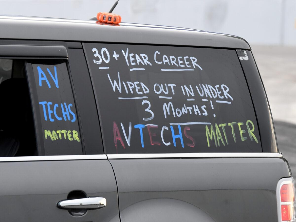 Chalk marker messages are written on the windows of a vehicle participating in a "Drive and March" event held by We...The Entertainment Community of Las Vegas (WE/EC) down the Las Vegas Strip in support of the Las Vegas entertainment industry that has been decimated by pandemic-fueled restrictions, in Las Vegas, Nev., on Aug. 19, 2020. (Ethan Miller/Getty Images)