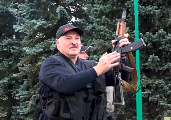This image made from video shows Belarus President Alexander Lukashenko armed with a Kalashnikov-type rifle near the Palace of Independence in Minsk on Aug. 23, 2020. (State TV and Radio Company of Belarus via AP Photo)