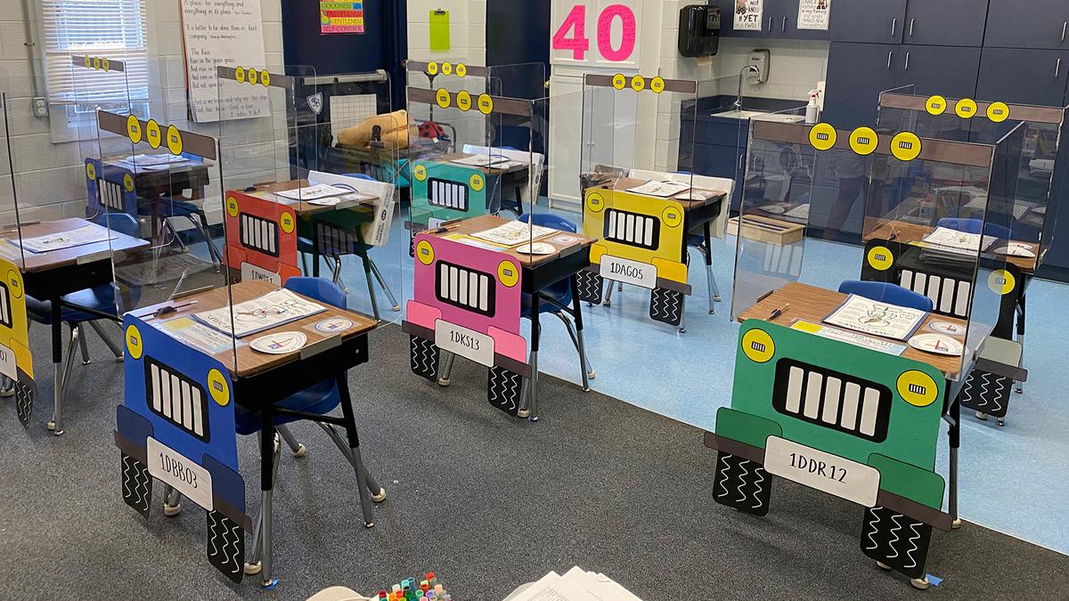 Patricia Dovi, 35, and Kim Martin, 51, of St. Barnabas Episcopal School spent a week redesigning the desks, which feature construction paper tires, headlights, and license plates. (Courtesy of Patricia Dovi)