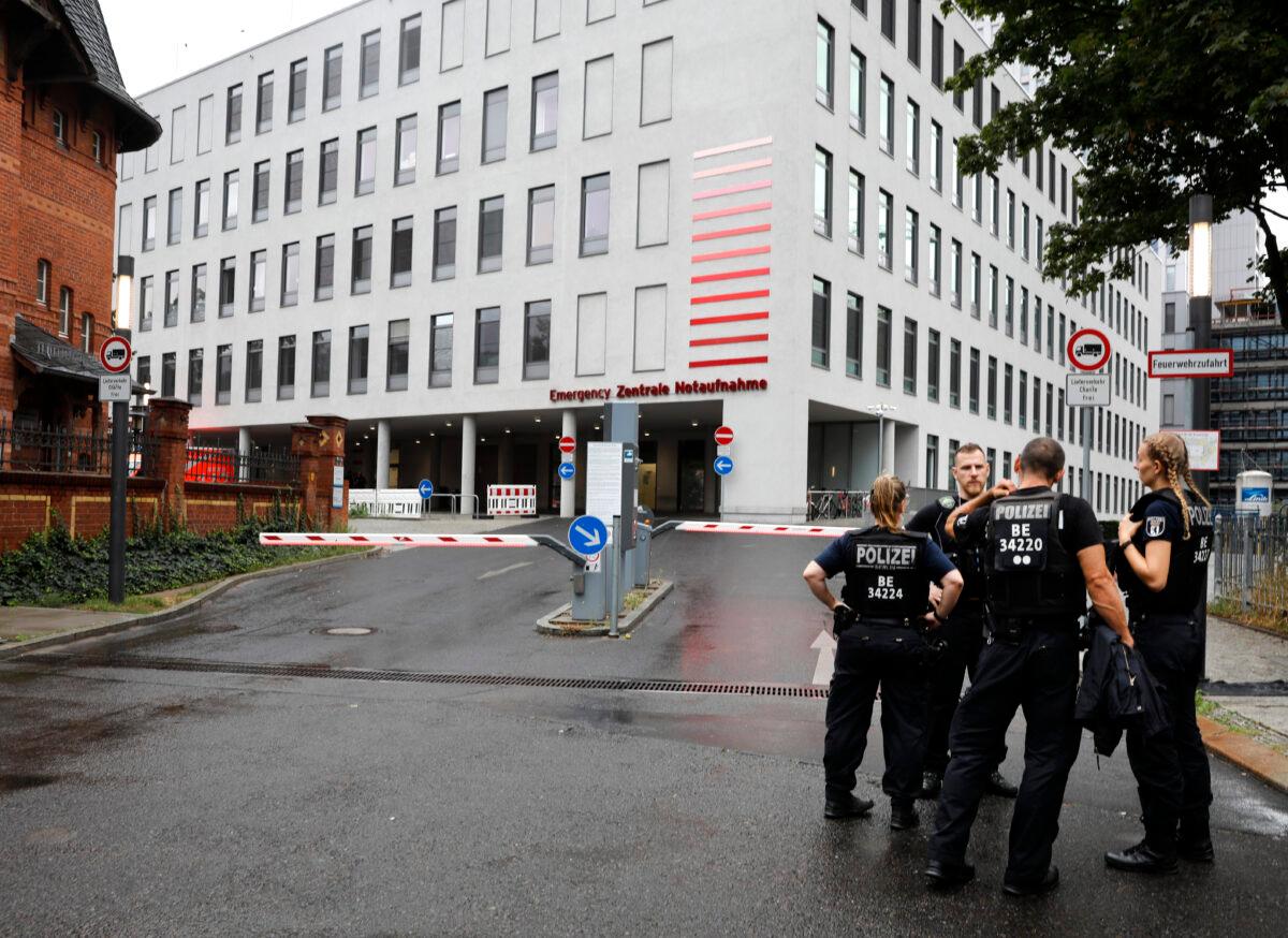 German police officers stand in front of the emergency entrance of the Charite hospital, in Berlin, on Aug. 22, 2020. (Markus Schreiber/AP Photo)