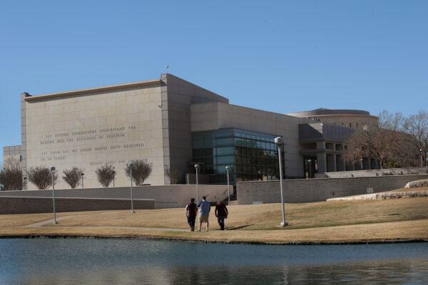 Visitors walk along a pond behind the George H.W. Bush Presidential Library Center on the campus of Texas A&M University in College Station, Texas, on Dec. 2, 2018. (Scott Olson/Getty Images)