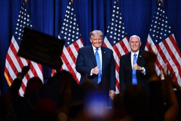 President Donald Trump and Vice President Mike Pence on stage during the first day of the Republican National Convention in Charlotte, N.C., on Aug. 24, 2020. (Brendan Smialowski/AFP via Getty Images)